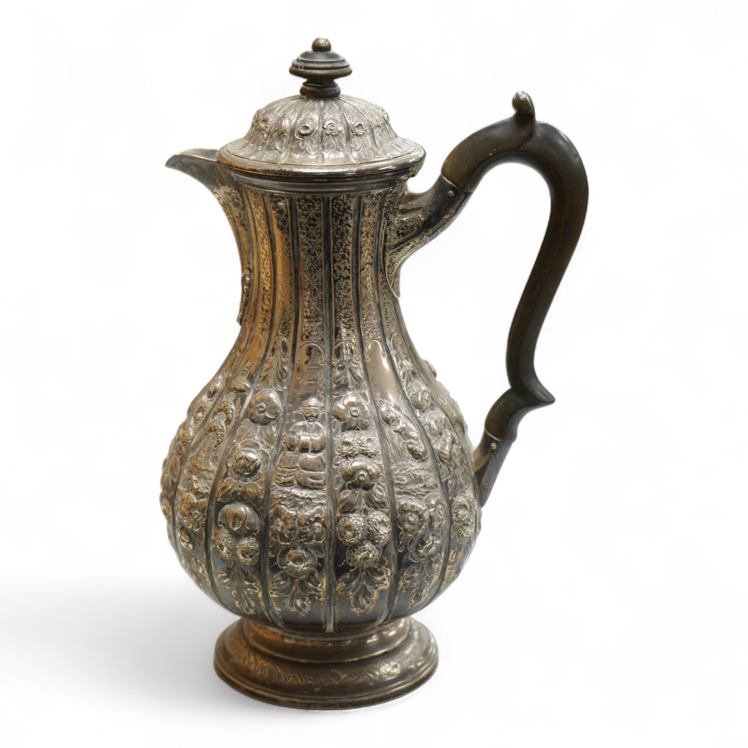A late Victorian embossed silver hot water jug, of baluster form, F.B. Thomas & Co, London, 1892, height 25.5cm, gross weight 18.4oz.